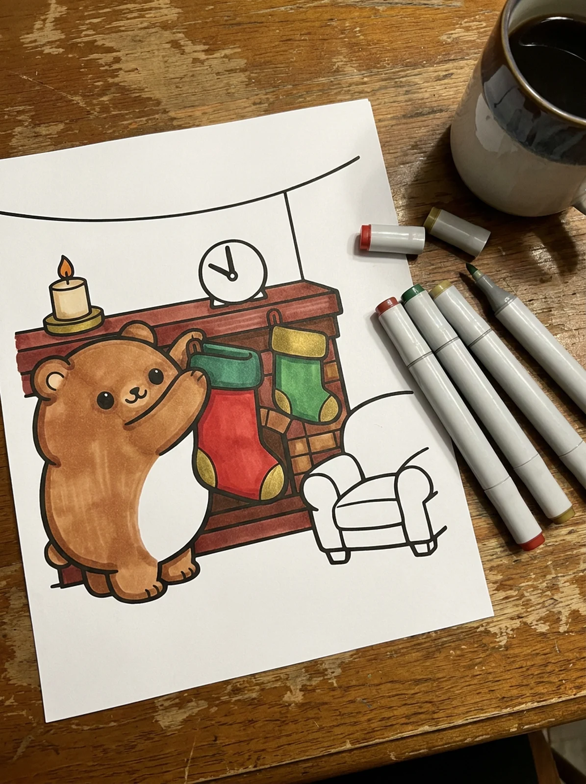 Bear Hanging a Christmas Stocking coloring page printed and half colored with markers