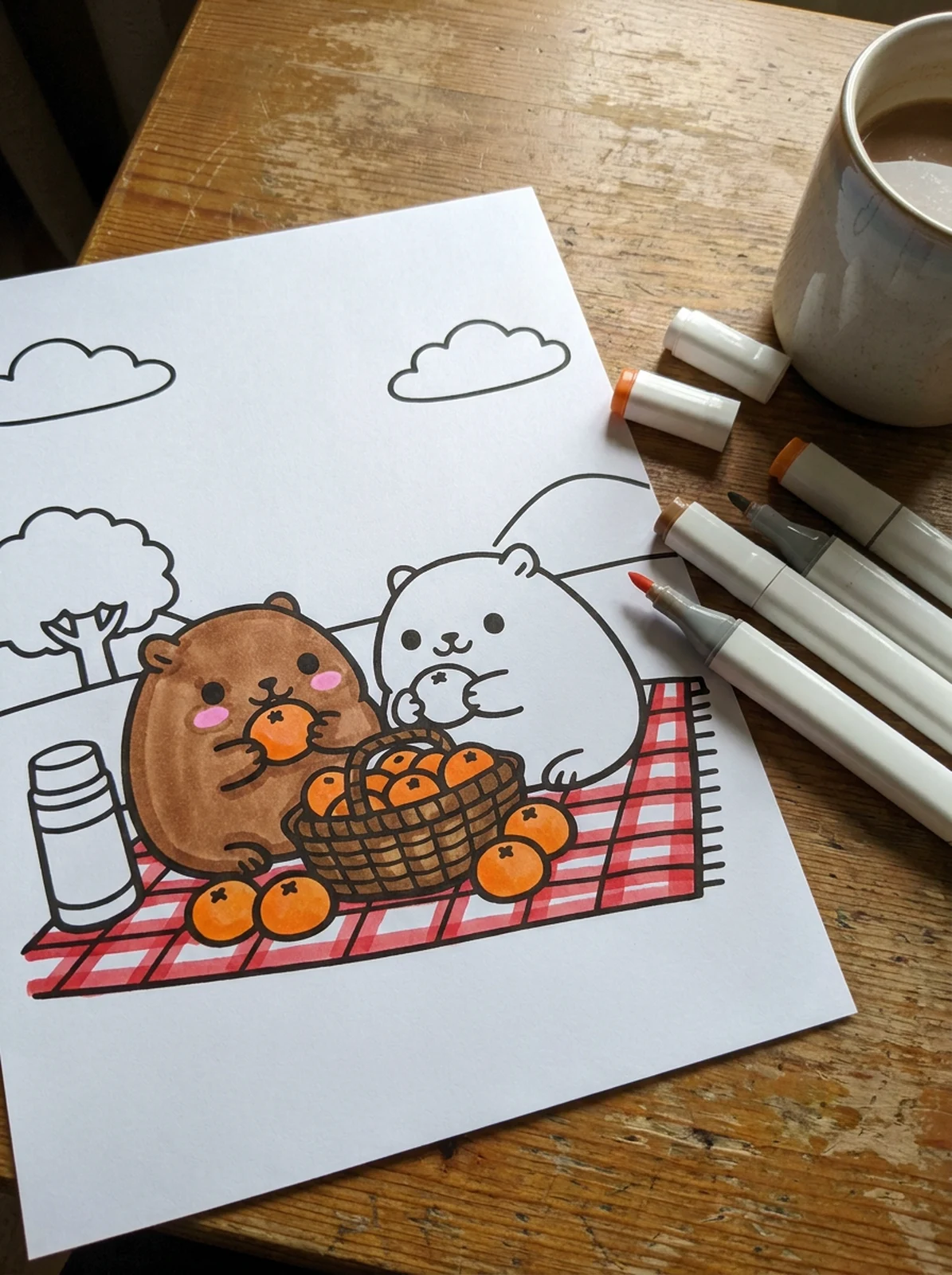 Capybara Picnic with Oranges coloring page printed and half colored with markers