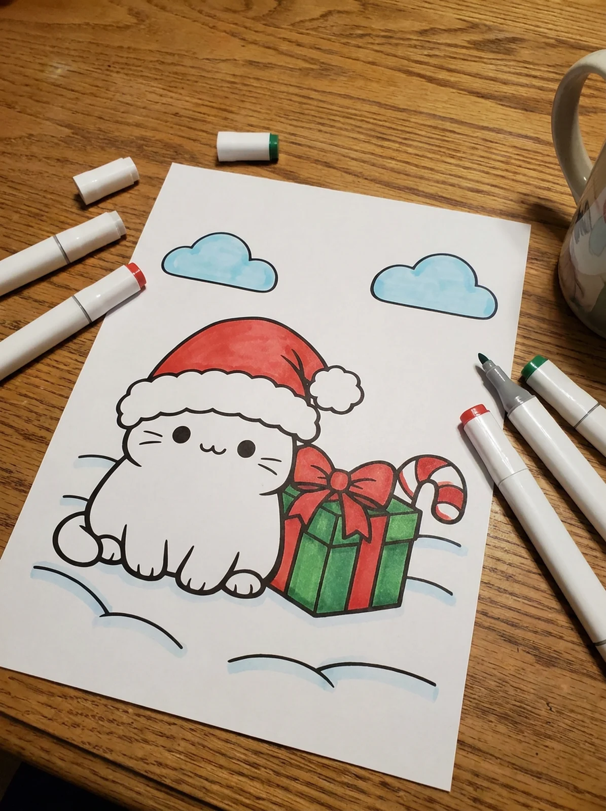 Cat in a Santa Hat coloring page printed and half colored with markers