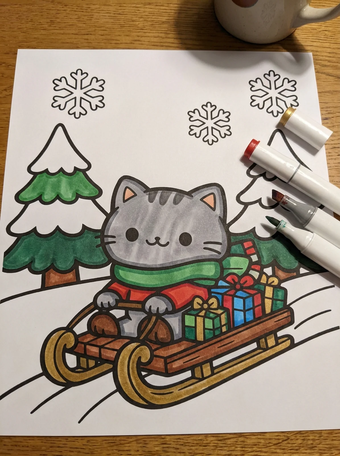 Cat Riding a Christmas Sleigh coloring page printed and half colored with markers