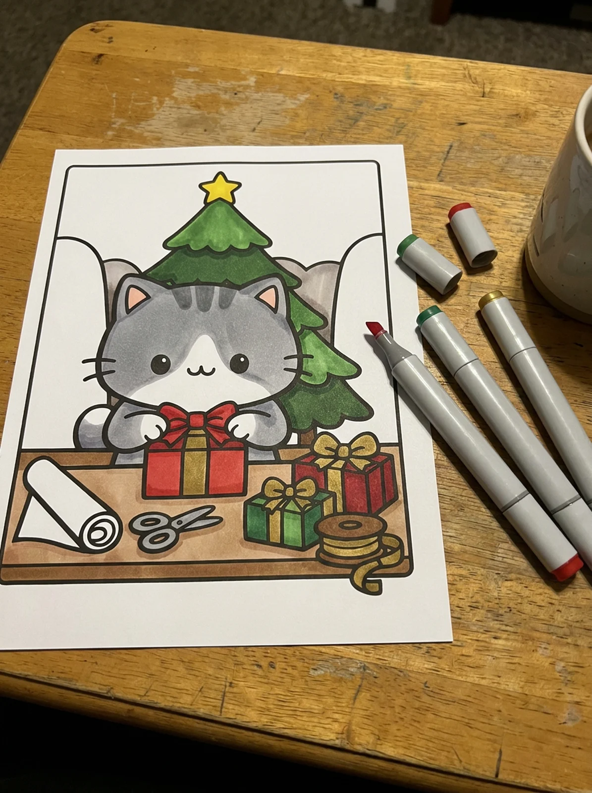 Cat Wrapping Christmas Presents coloring page printed and half colored with markers
