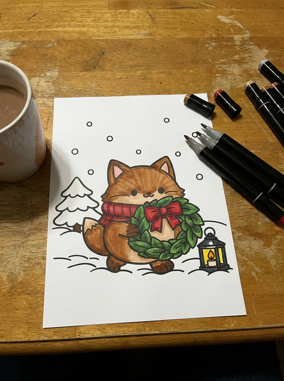Fox Carrying a Christmas Wreath coloring page printed and half colored with markers