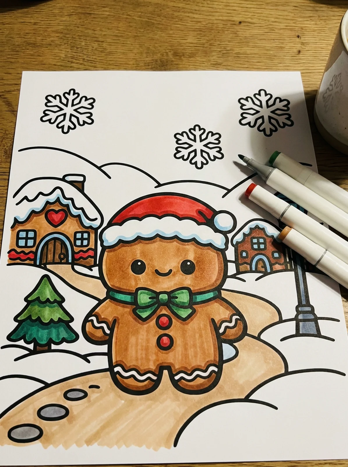 Gingerbread Village in the Snow coloring page printed and half colored with markers