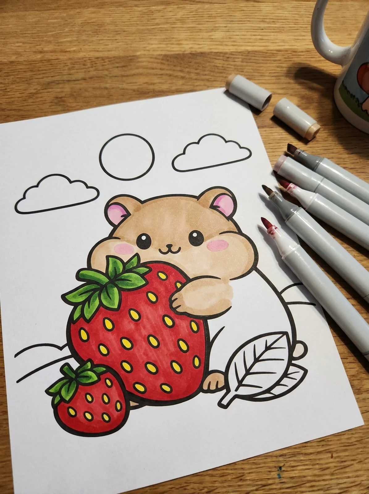 Hamster with a Big Strawberry coloring page printed and half colored with markers