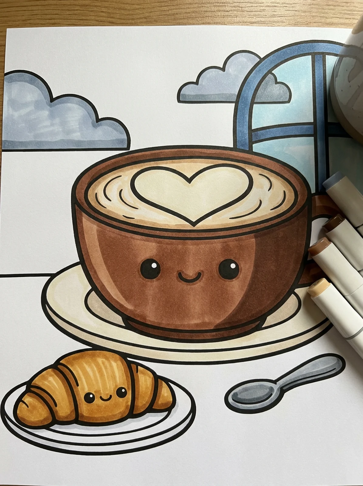 Latte with a Croissant coloring page printed and half colored with markers