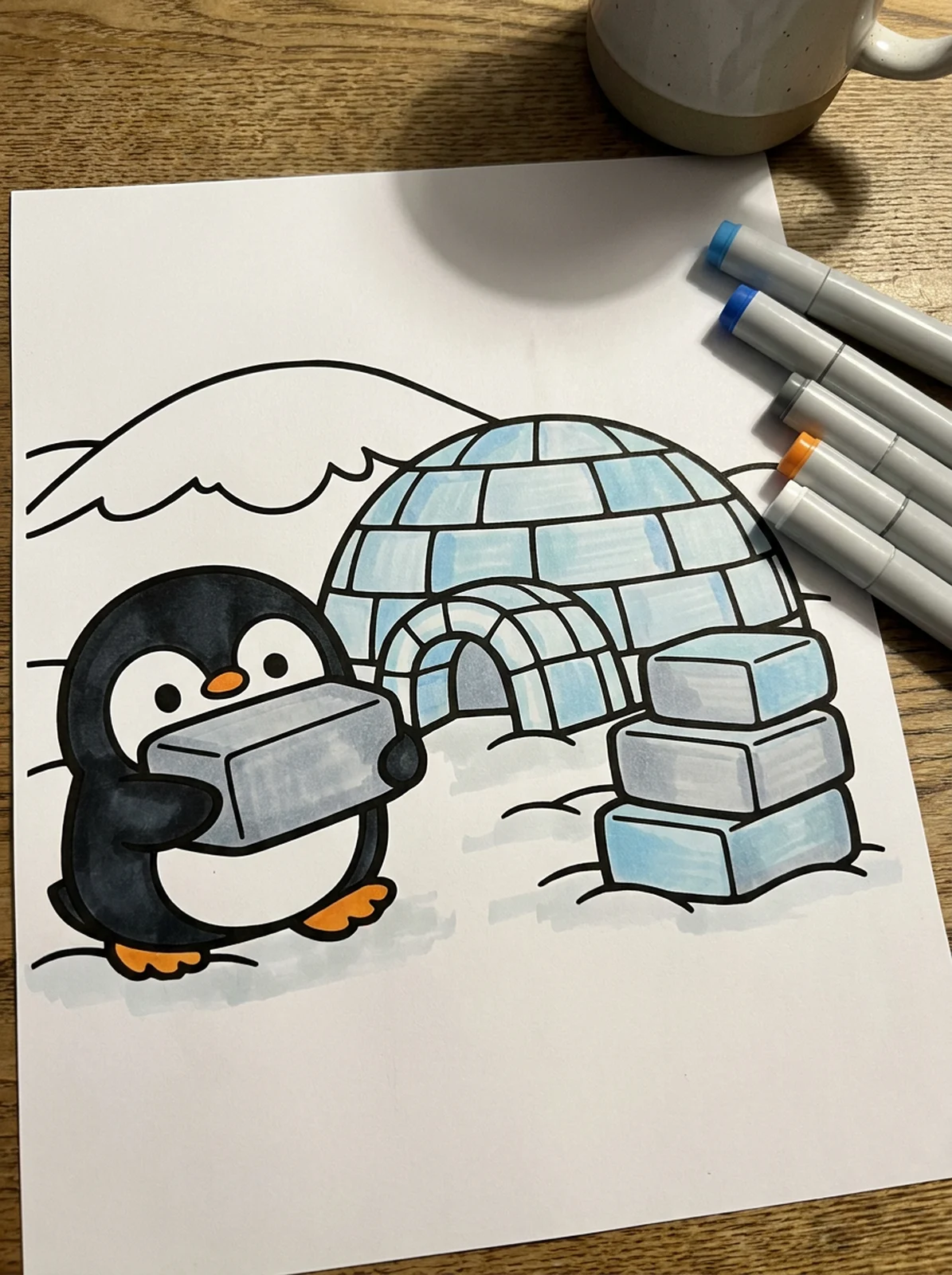 Penguin Building an Igloo coloring page printed and half colored with markers