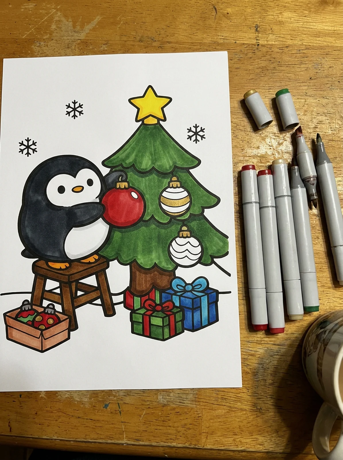 Penguin Decorating a Christmas Tree coloring page printed and half colored with markers