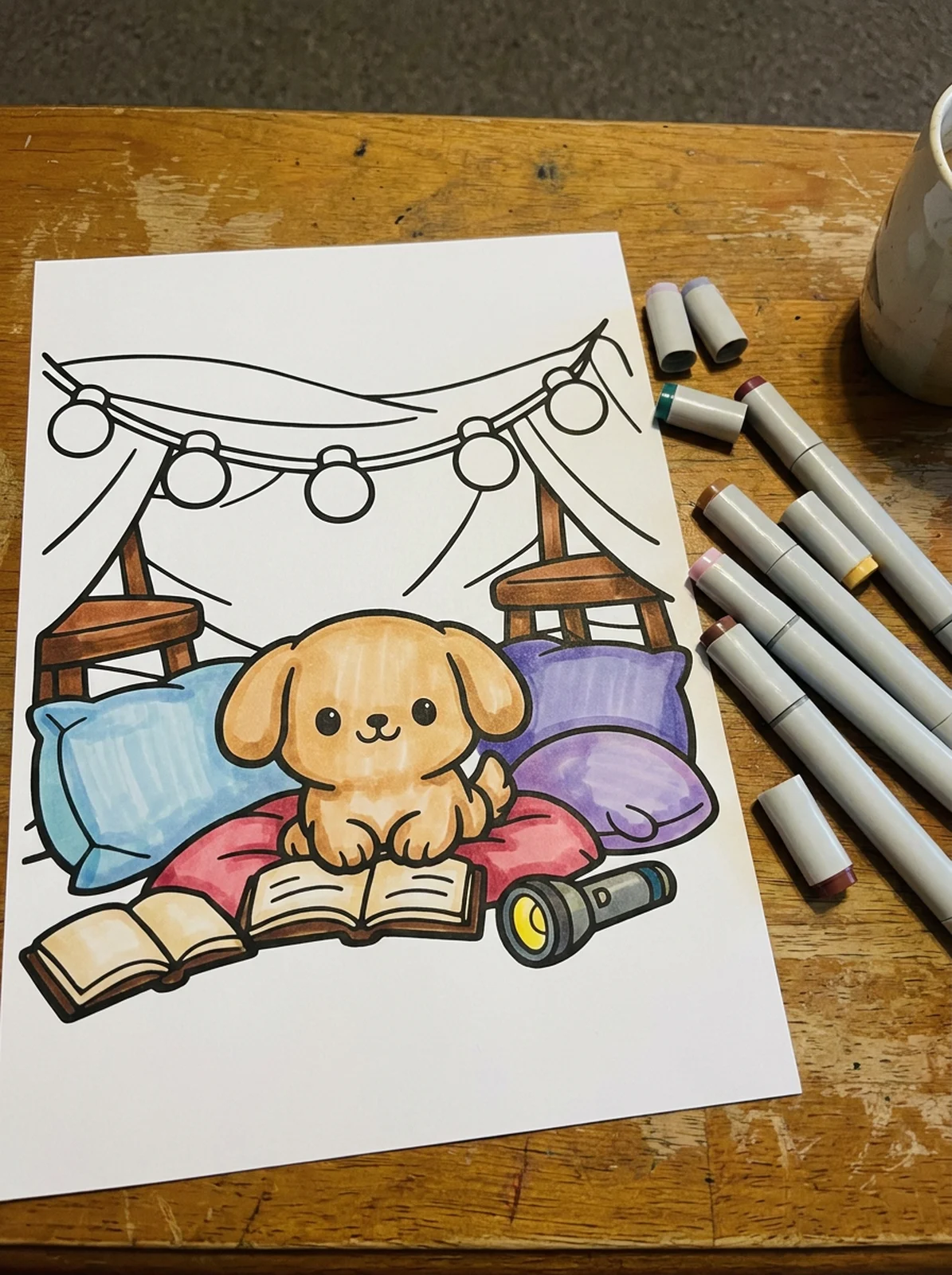 Puppy in a Blanket Fort coloring page printed and half colored with markers