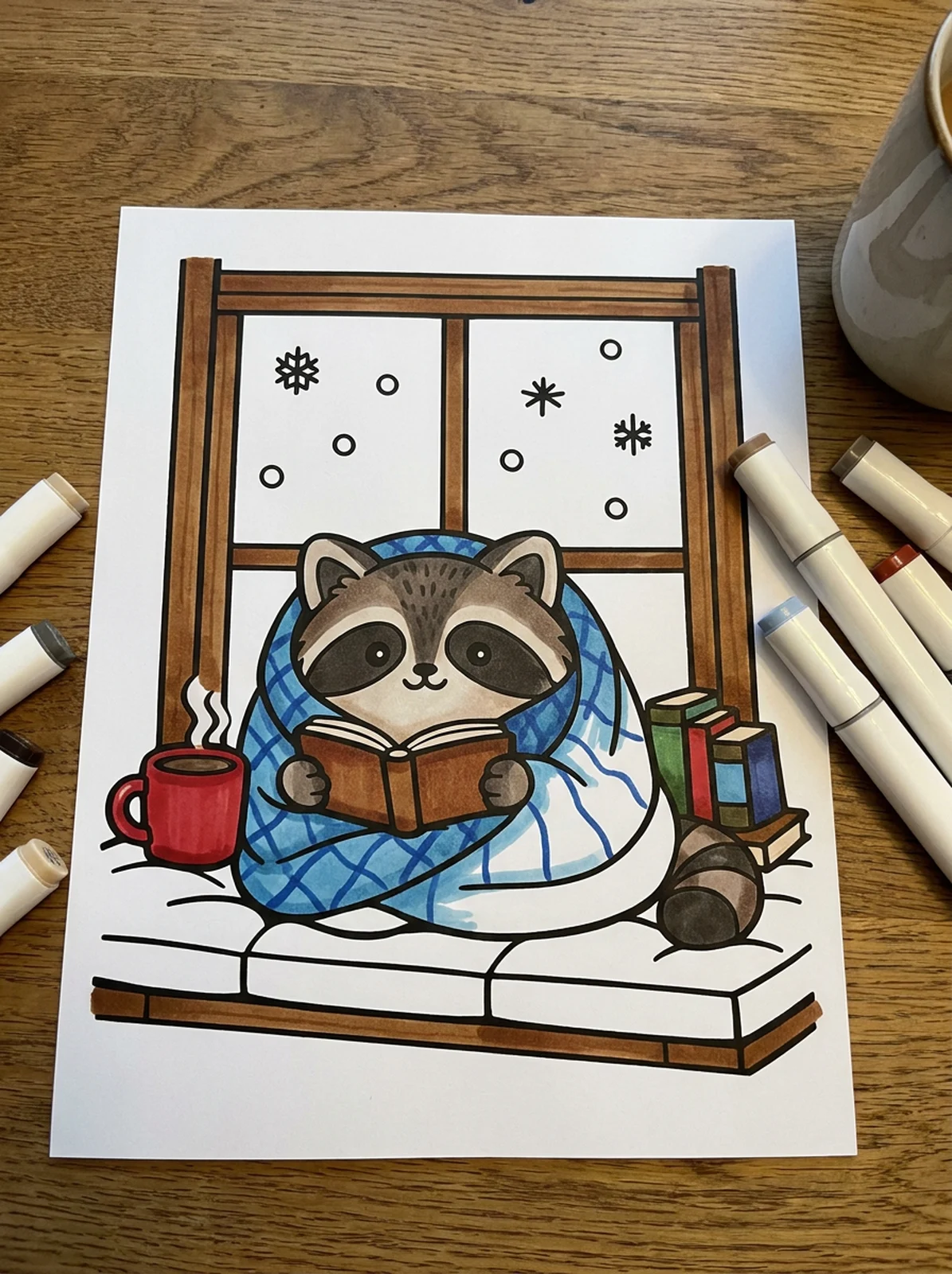 Raccoon Reading on a Snow Day coloring page printed and half colored with markers